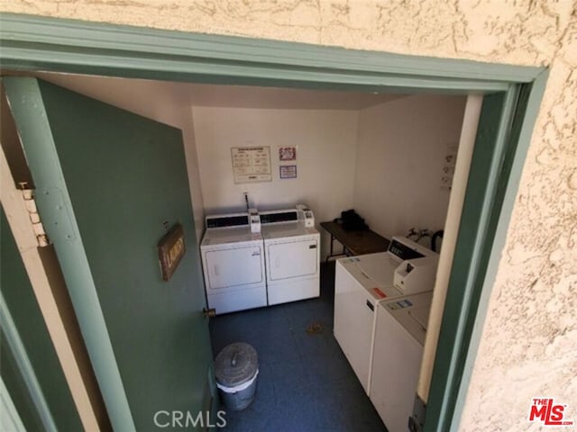 washroom featuring washer and dryer