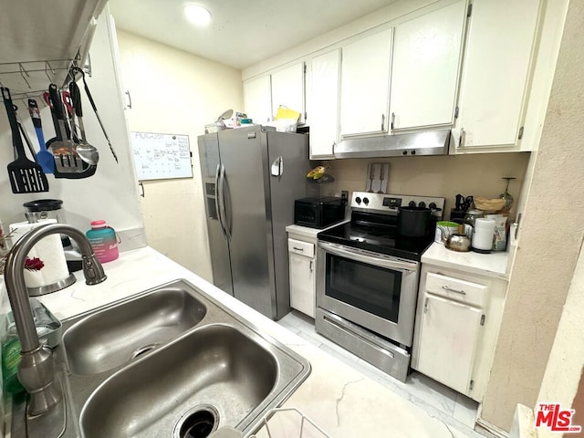 kitchen featuring white cabinets, sink, and stainless steel appliances