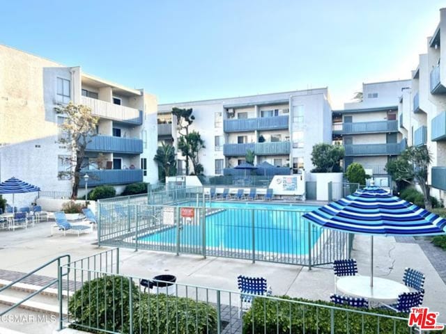 view of swimming pool featuring a patio area