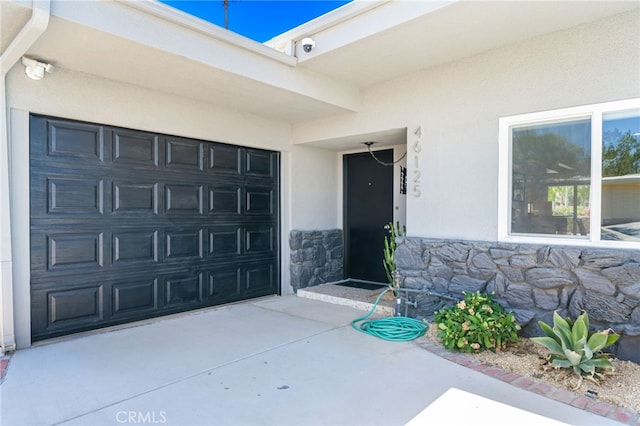 property entrance with a garage