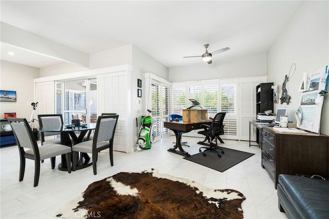 office area with ceiling fan and light tile patterned floors