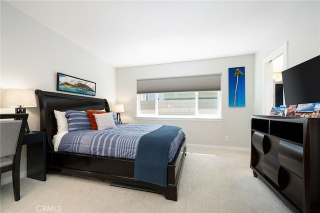 bedroom featuring light colored carpet