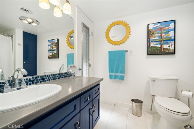 bathroom with vanity and toilet