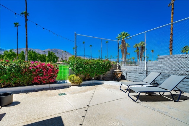 view of patio / terrace featuring a mountain view