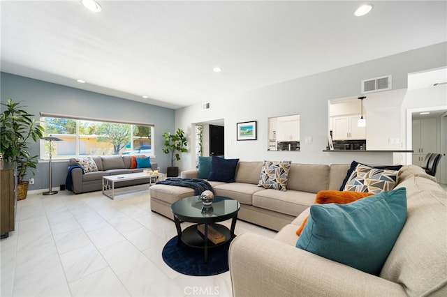 living room featuring vaulted ceiling