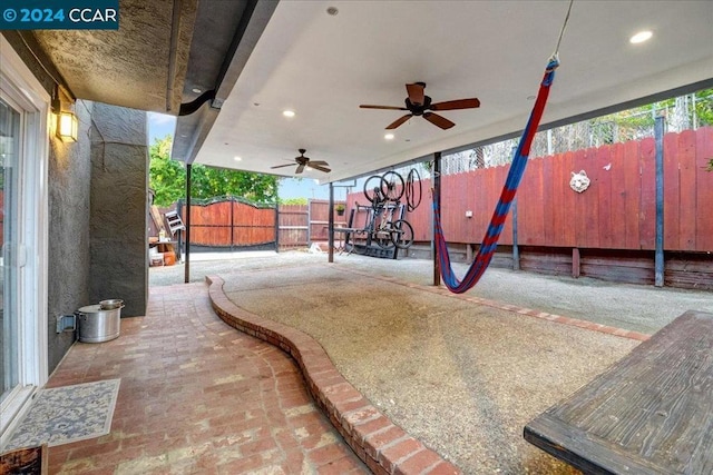 view of patio featuring ceiling fan