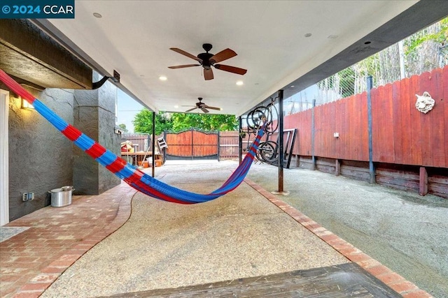 view of playground with ceiling fan and a patio area