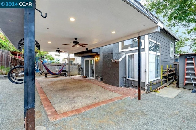 view of patio featuring ceiling fan