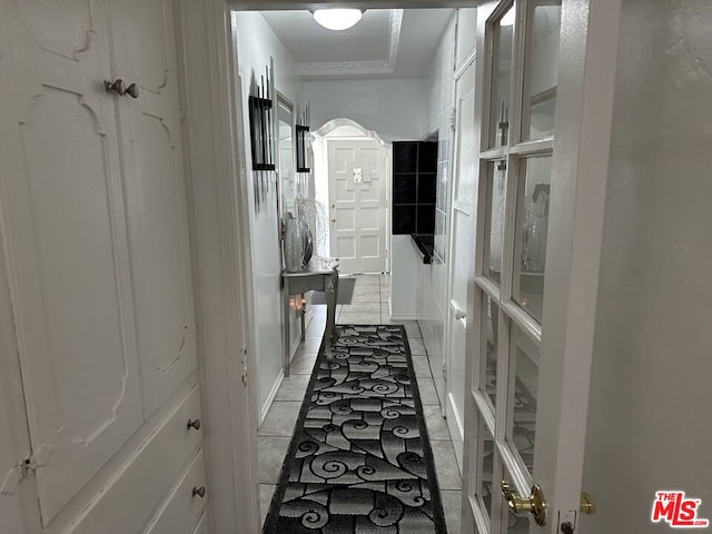 corridor featuring light tile patterned flooring