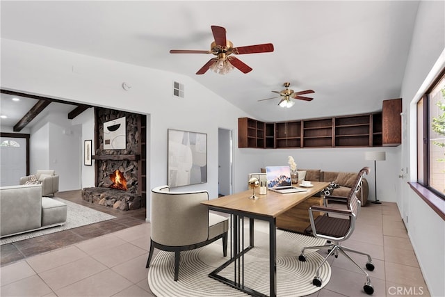 tiled office featuring ceiling fan, lofted ceiling, and a fireplace