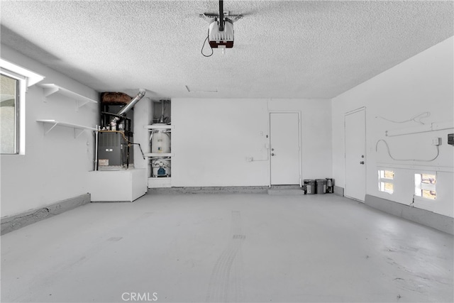 garage with heating unit and a garage door opener