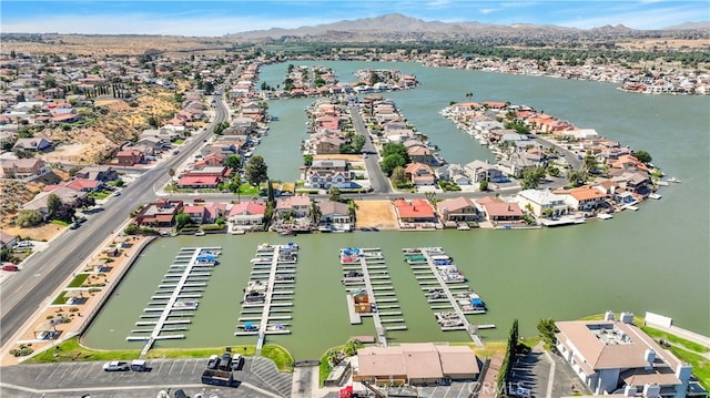 birds eye view of property featuring a water and mountain view