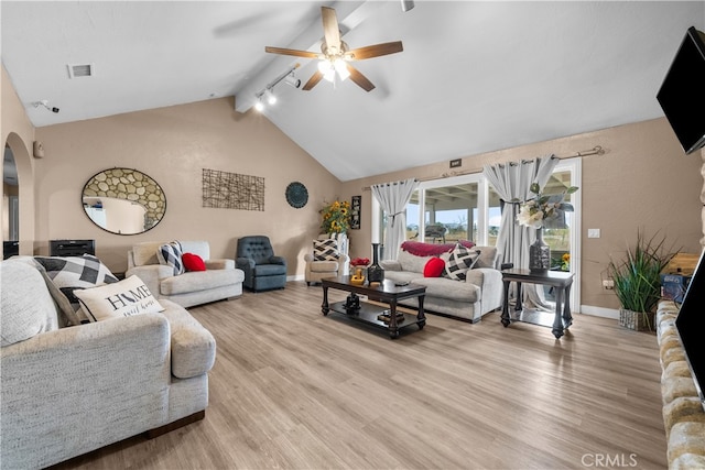 living room with ceiling fan, lofted ceiling with beams, and light hardwood / wood-style floors