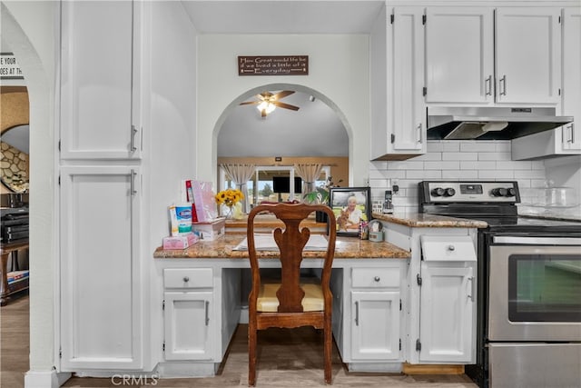 kitchen with stainless steel range with electric stovetop, light stone countertops, and white cabinetry