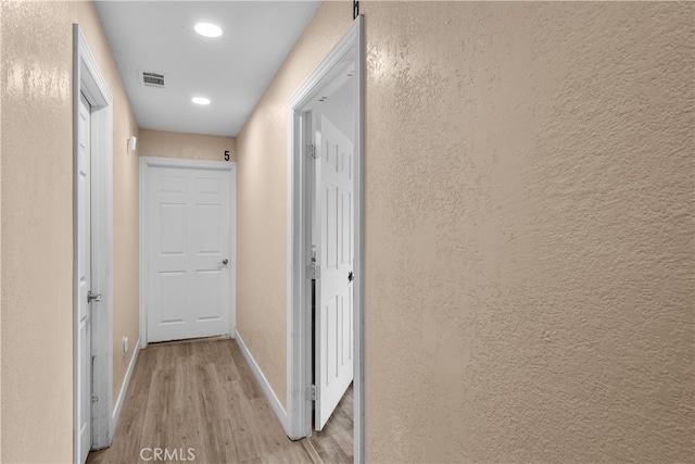 hallway featuring light hardwood / wood-style floors