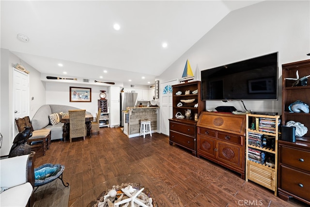 living room with lofted ceiling and dark hardwood / wood-style floors