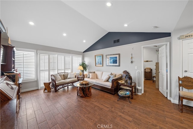 living room with lofted ceiling and hardwood / wood-style flooring