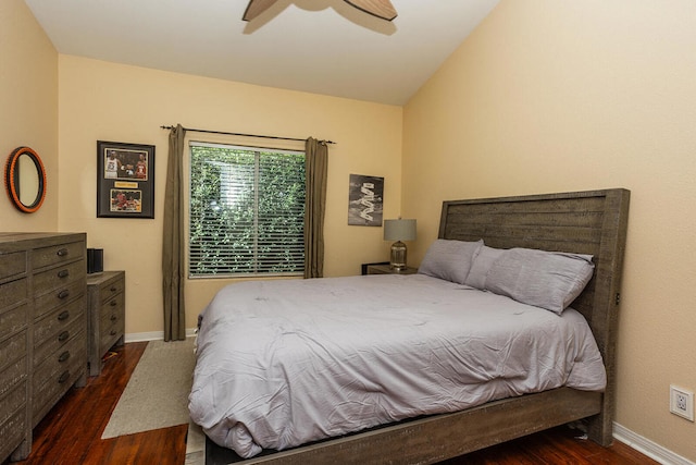 bedroom with ceiling fan, lofted ceiling, and dark hardwood / wood-style flooring