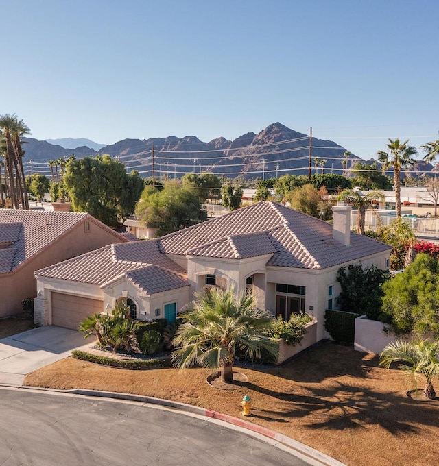 birds eye view of property featuring a mountain view