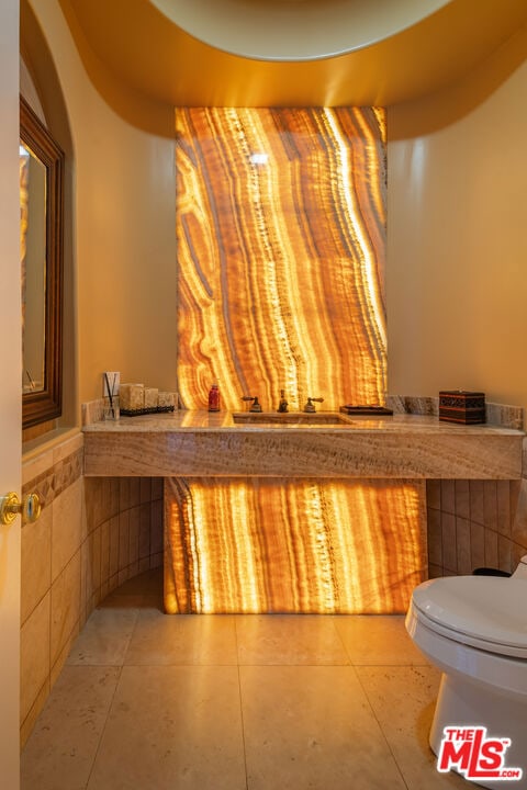 bathroom with tile patterned floors and toilet