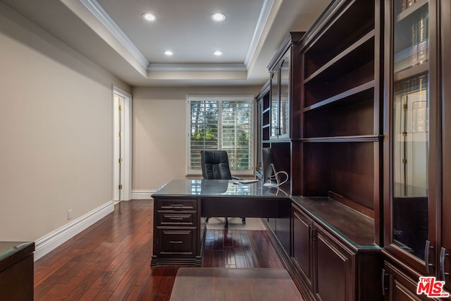 office area featuring a raised ceiling, crown molding, and dark hardwood / wood-style floors