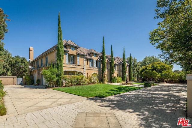 view of front of property with a front lawn