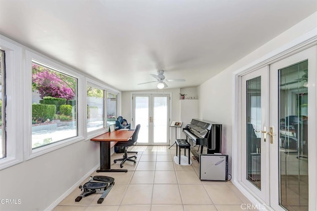 home office with ceiling fan, french doors, and light tile patterned flooring