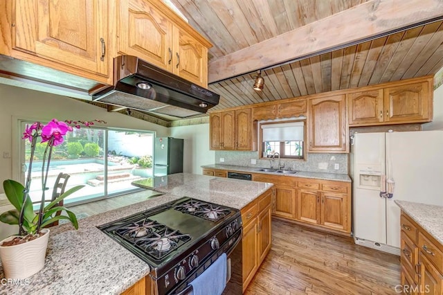 kitchen with sink, wooden ceiling, backsplash, black appliances, and light wood-type flooring