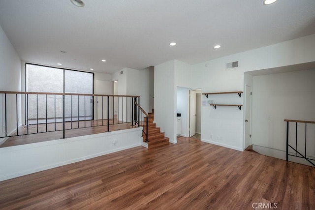 empty room with hardwood / wood-style flooring