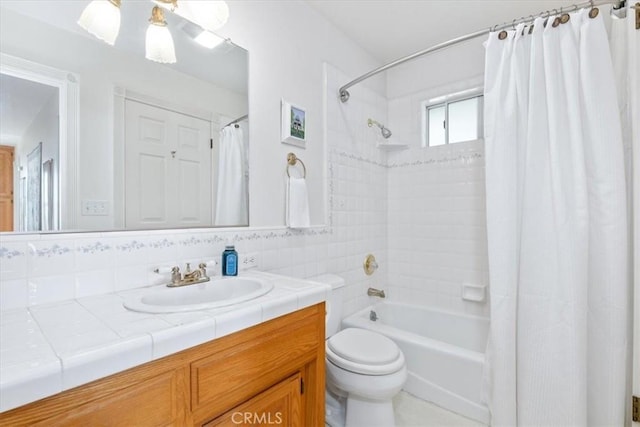 full bathroom featuring backsplash, toilet, vanity, and shower / bath combination with curtain