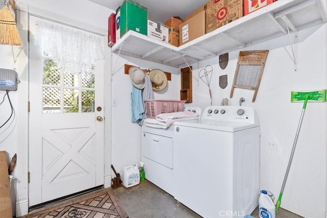 washroom featuring washer and clothes dryer