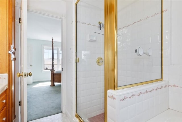 bathroom with an enclosed shower and vanity