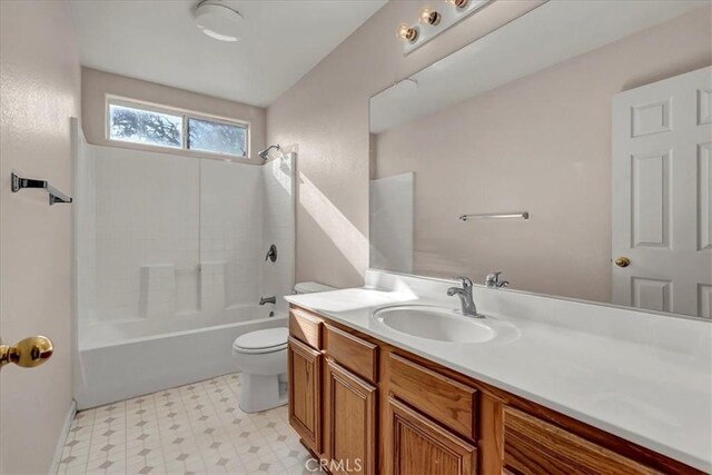 full bathroom featuring toilet, shower / bathtub combination, and vanity