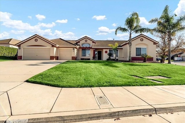 view of front of home featuring a front yard and a garage