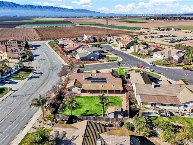 birds eye view of property featuring a mountain view