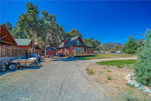 view of jungle gym with a deck with mountain view