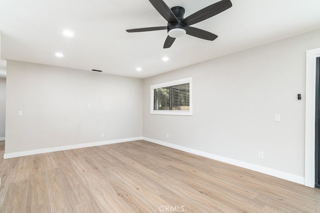 unfurnished room with light hardwood / wood-style flooring and ceiling fan