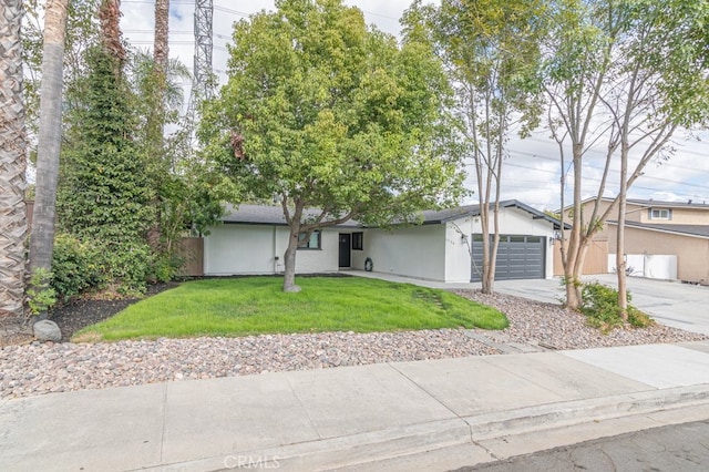 ranch-style house featuring a garage and a front yard