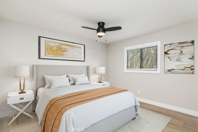 bedroom featuring ceiling fan and hardwood / wood-style floors