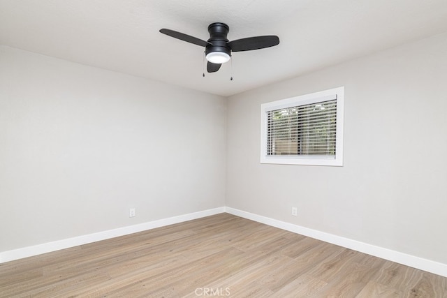 empty room with light wood-type flooring and ceiling fan