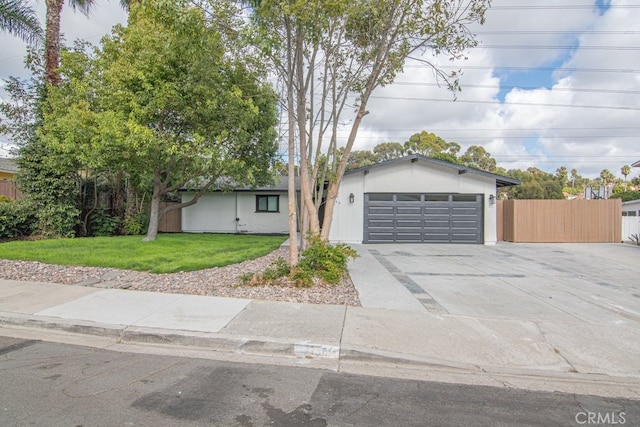 ranch-style house with a front lawn and a garage