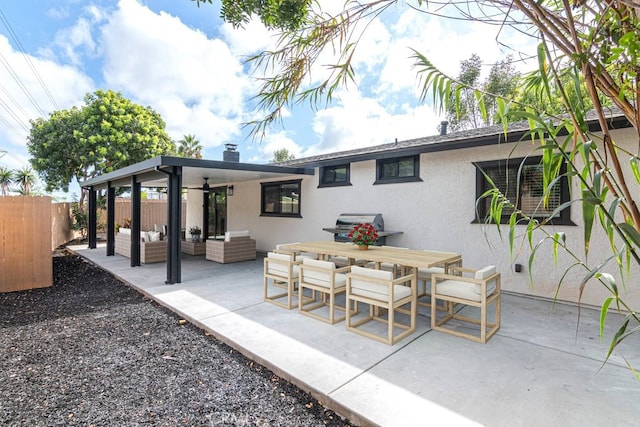 view of patio with outdoor lounge area, ceiling fan, and a grill