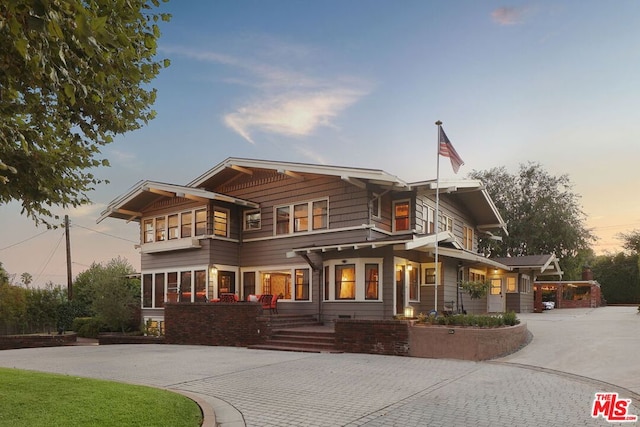 view of front of house featuring a balcony