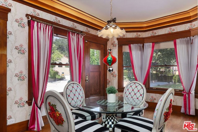 dining room with a notable chandelier and hardwood / wood-style floors