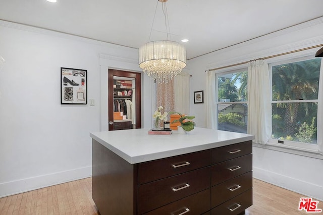 interior space featuring an inviting chandelier and light hardwood / wood-style flooring