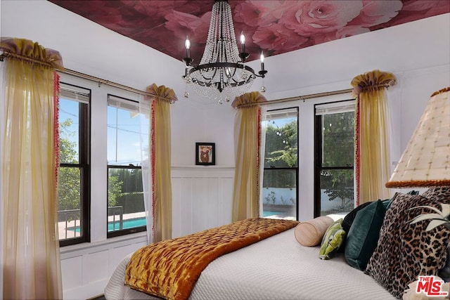 bedroom with an inviting chandelier