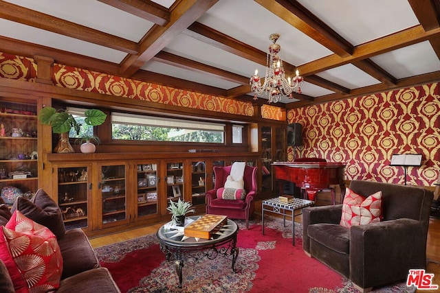 living room featuring beam ceiling, coffered ceiling, a chandelier, and hardwood / wood-style floors