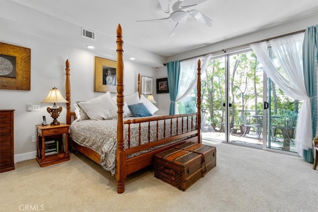 bedroom featuring access to exterior, light colored carpet, and ceiling fan