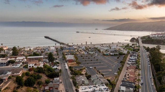 aerial view at dusk with a water view