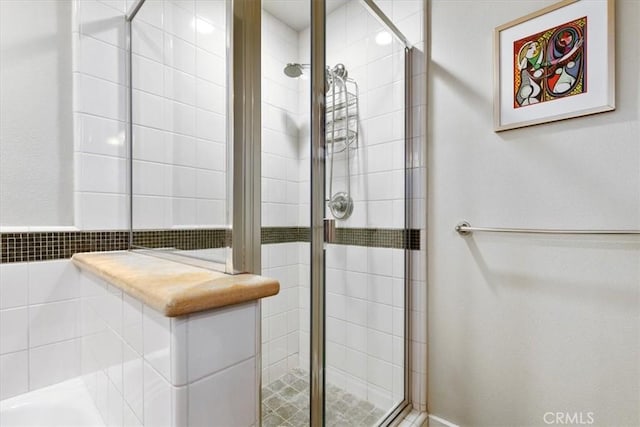 bathroom with tiled shower